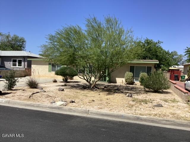 a view of a house with a snow in the yard