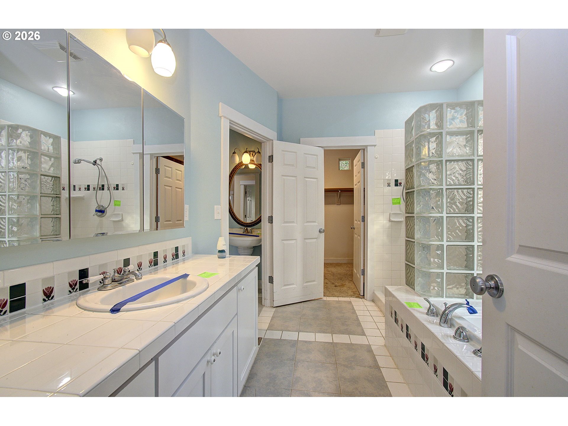 66743 Doetsch Road Deer Island, OR 97054 - Photo 17 of 43 a bathroom with a sink double vanity granite tub shower and a mirror
