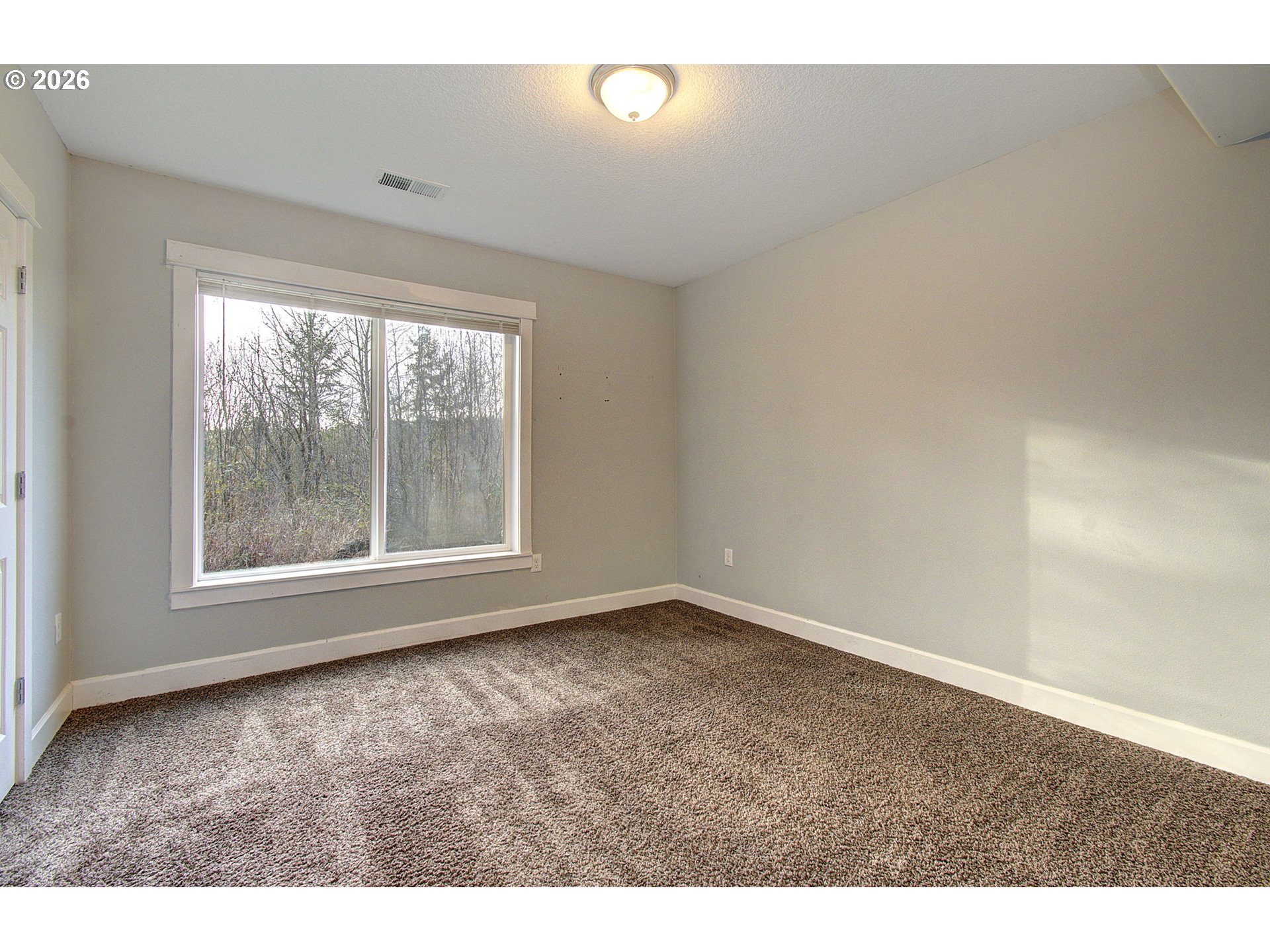 66743 Doetsch Road Deer Island, OR 97054 - Photo 19 of 43 a view of an empty room with a window