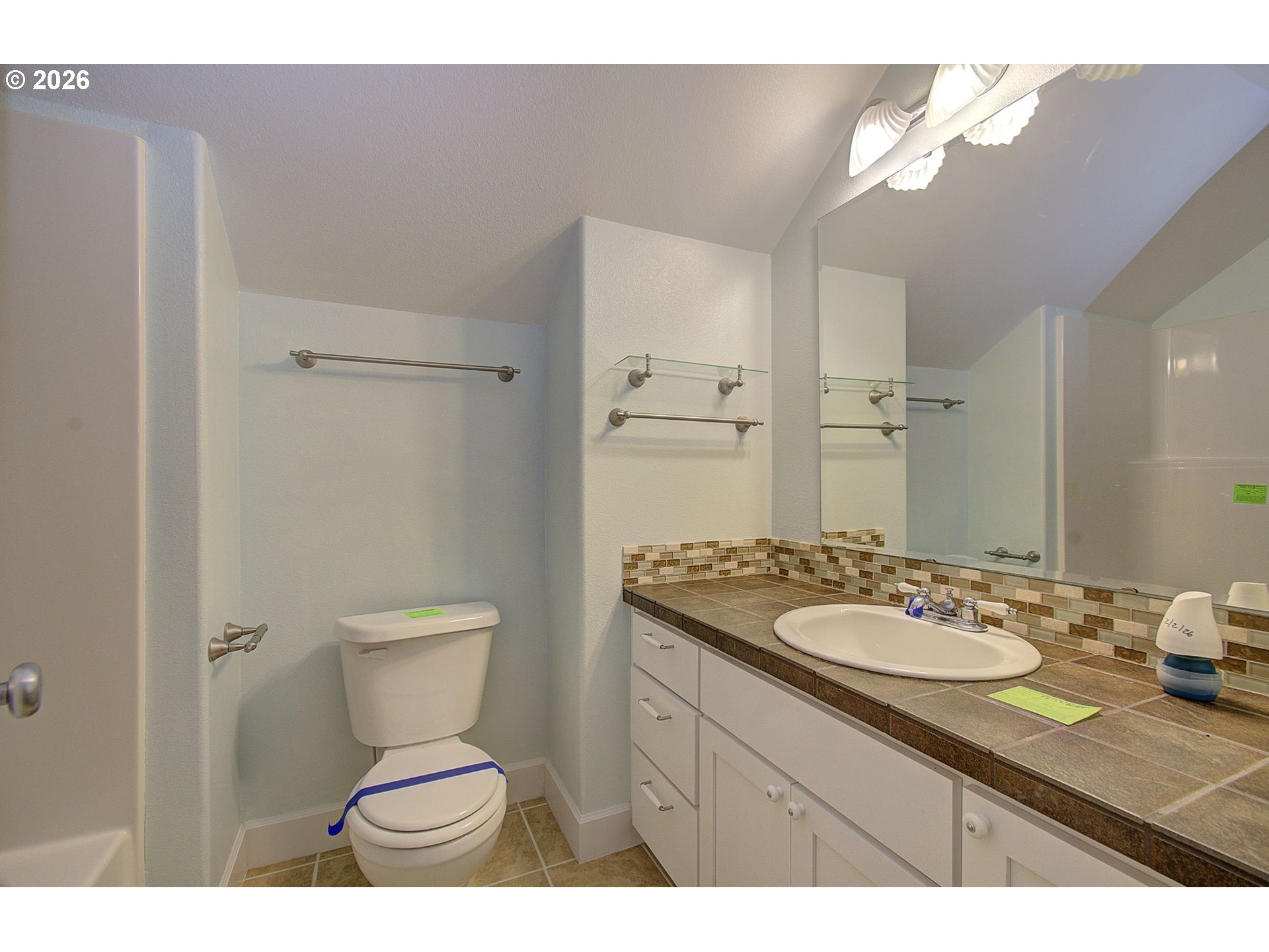 66743 Doetsch Road Deer Island, OR 97054 - Photo 28 of 43 a bathroom with a granite countertop sink toilet a mirror and a shower