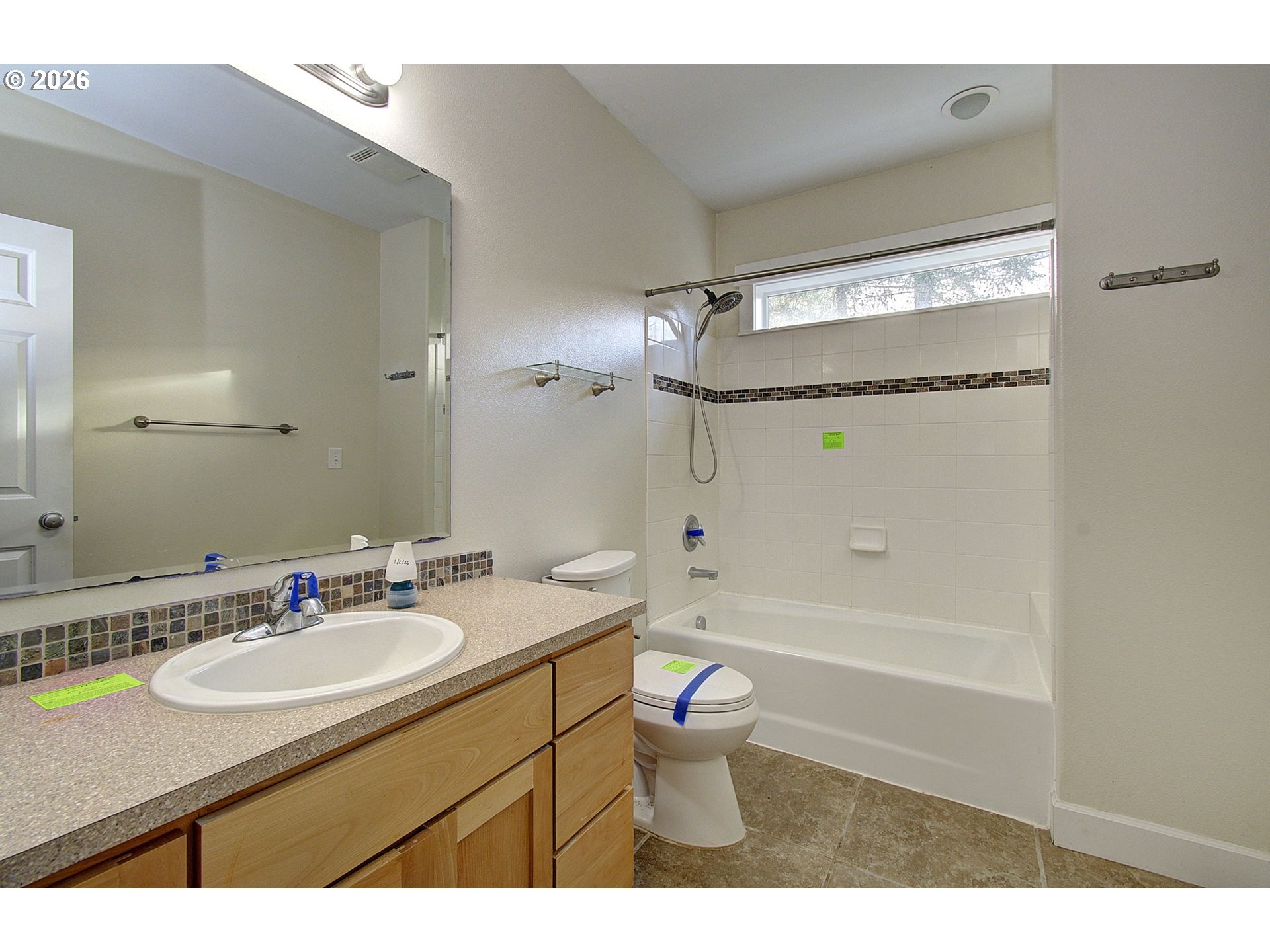 66743 Doetsch Road Deer Island, OR 97054 - Photo 30 of 43 a bathroom with a granite countertop sink a toilet a mirror and shower