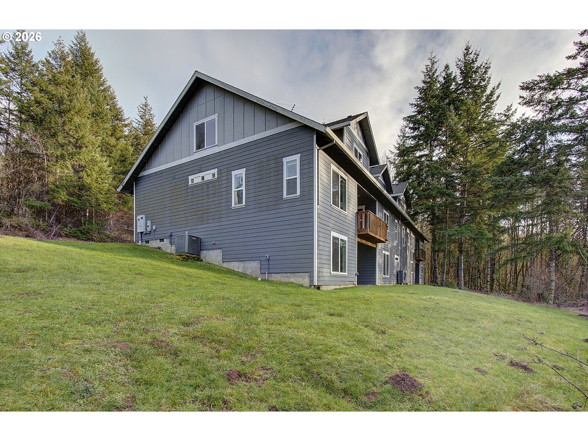 66743 Doetsch Road Deer Island, OR 97054 - Photo 34 of 43 a front view of house with yard and trees all around