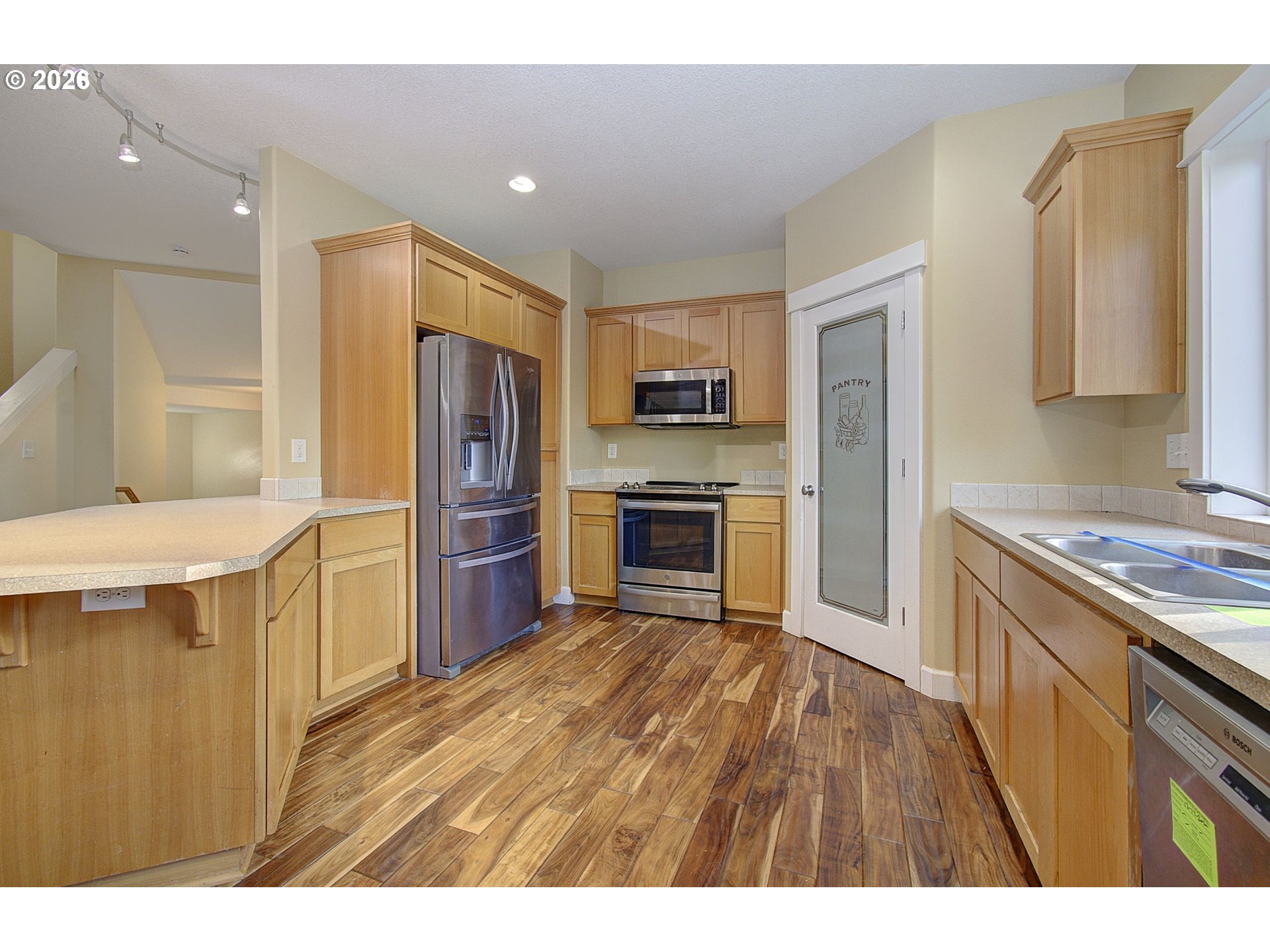 66743 Doetsch Road Deer Island, OR 97054 - Photo 4 of 43 a kitchen with granite countertop a stove a sink and a refrigerator