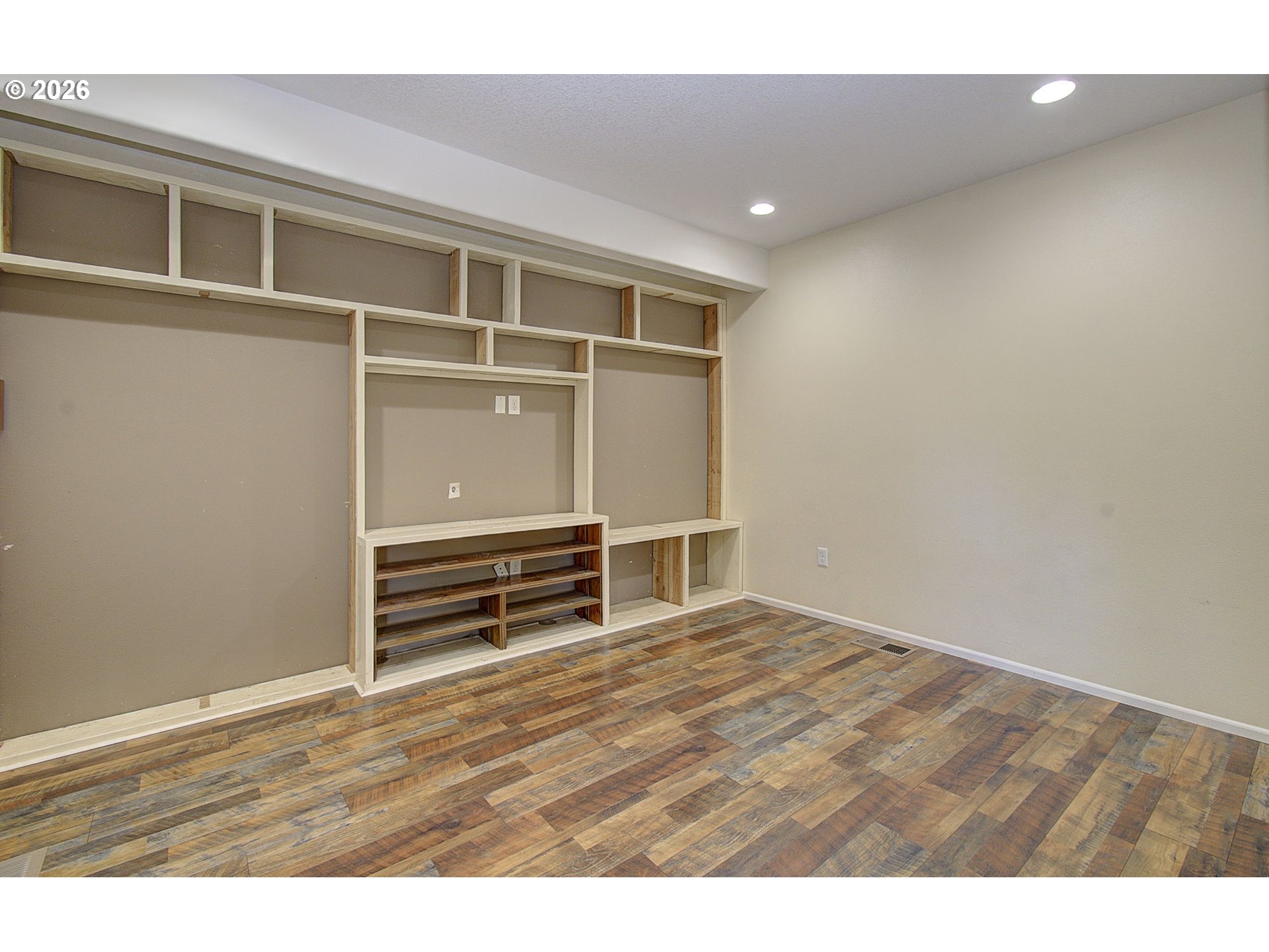 66743 Doetsch Road Deer Island, OR 97054 - Photo 6 of 43 a view of an empty room with wooden floor and a window