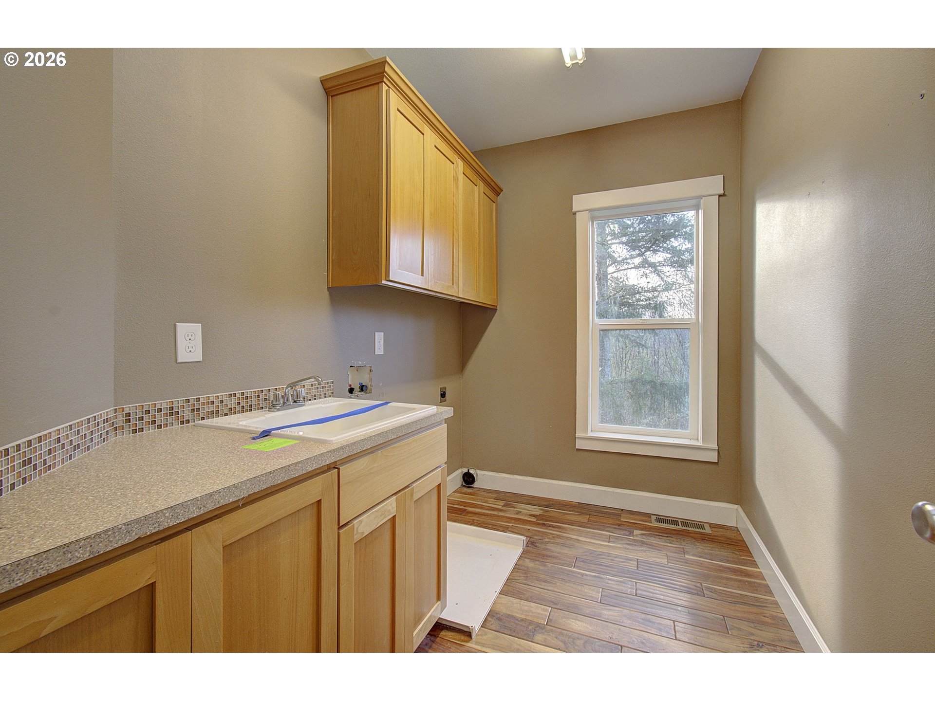 66743 Doetsch Road Deer Island, OR 97054 - Photo 7 of 43 a utility room with closet a window and a potted plant