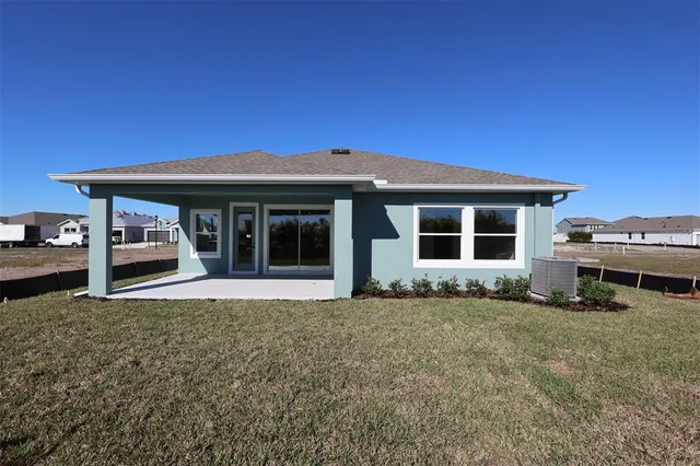 a view of a swimming pool with a table and chairs