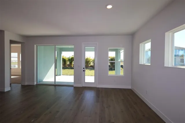 a view of a kitchen with a sink and a window