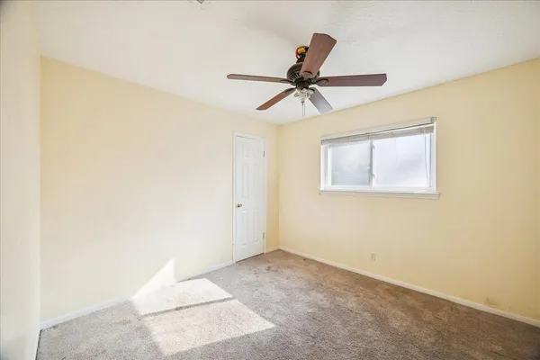 a view of a big room with carpet