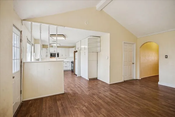 a view of a kitchen with wooden floor
