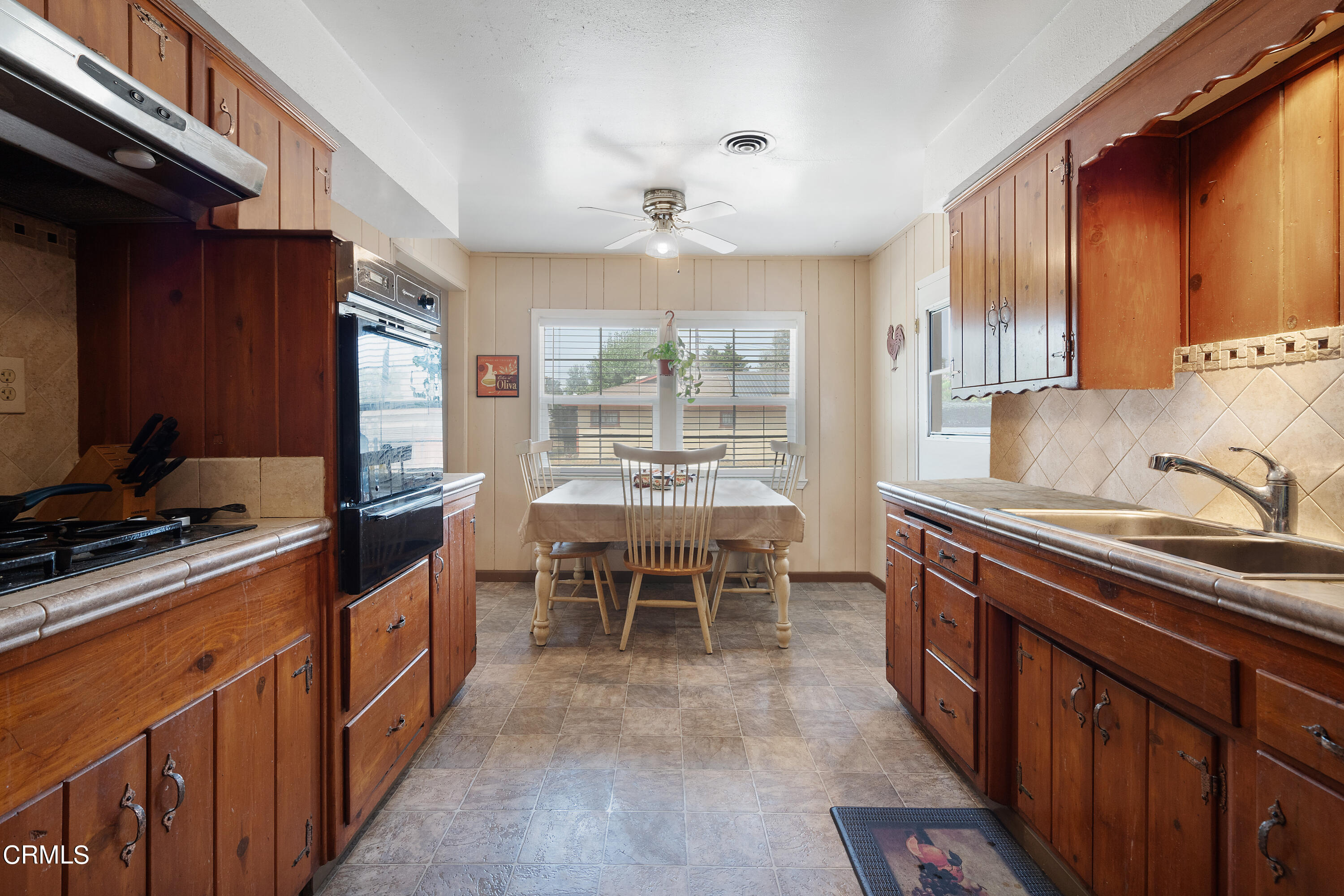 4161 Eve Road Simi Valley, CA 93063 - Photo 5 of 27 a kitchen with stainless steel appliances granite countertop sink stove top oven and cabinets