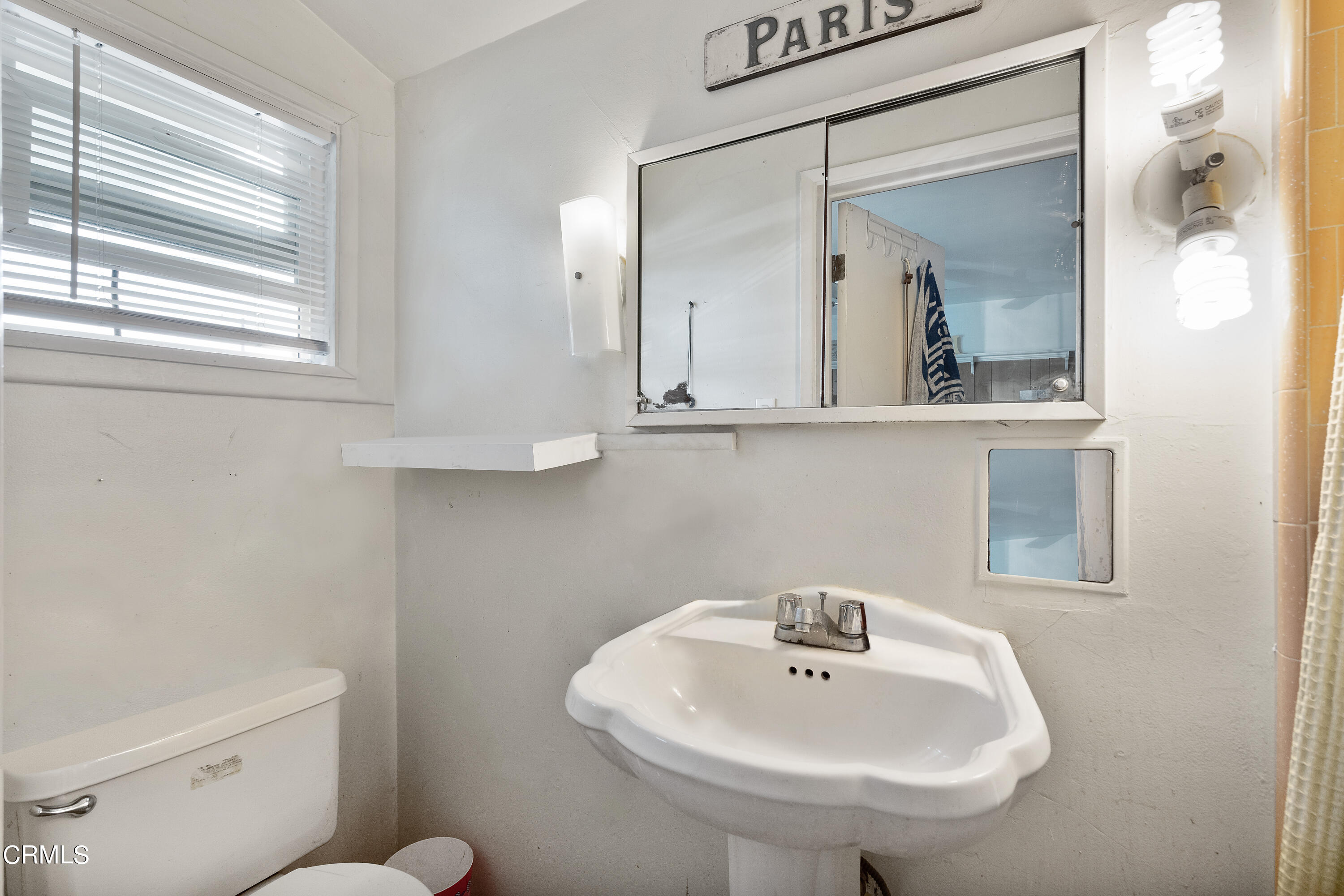 4161 Eve Road Simi Valley, CA 93063 - Photo 9 of 27 a bathroom with a toilet a sink and mirror