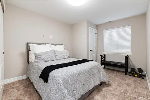 a bed room with a bed and a couch