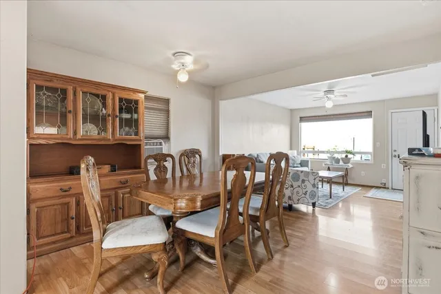 a dining room with furniture and window