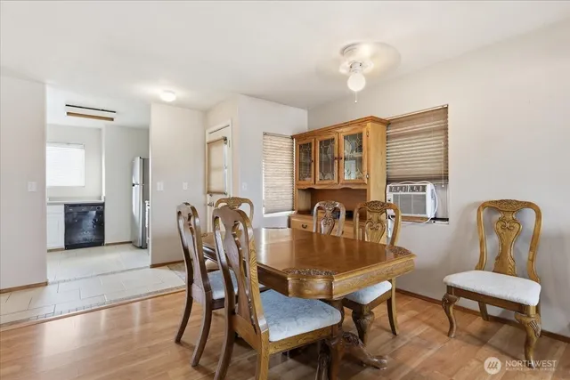 a dining room with furniture and window
