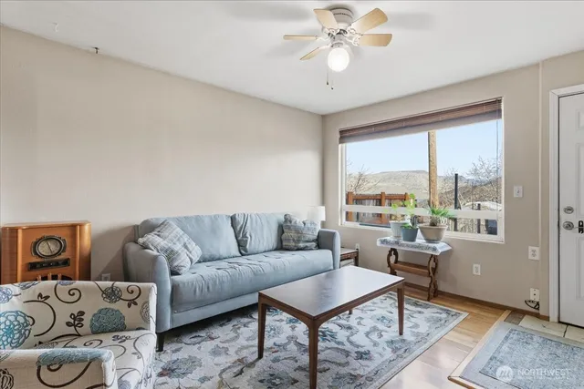 a living room with furniture and a large window