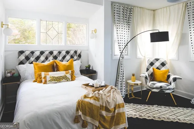 a bedroom with a bed and window