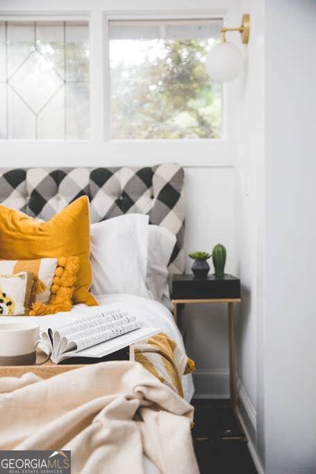 449 Greenwood Avenue Northeast, Unit 1 Atlanta, GA 30308 - Photo 15 of 27 a bedroom with a bed and window