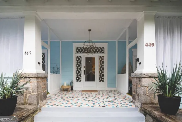 a view of an entryway with wooden floor