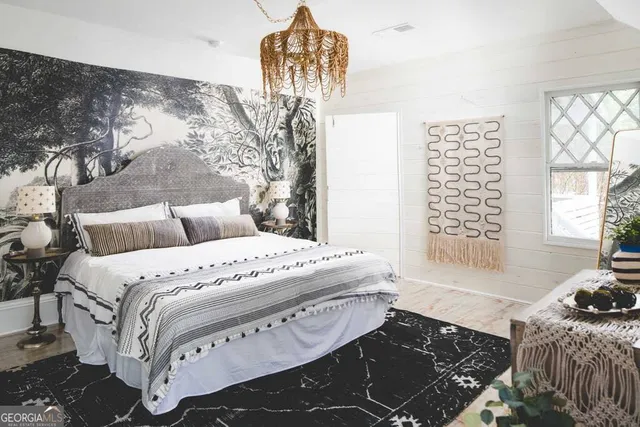 a bedroom with a bed and ceiling fan