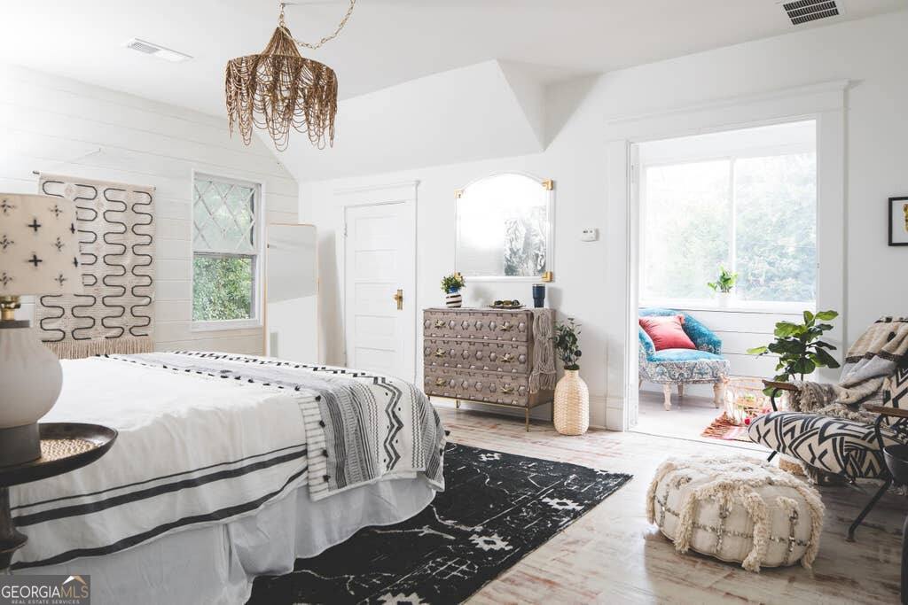 449 Greenwood Avenue Northeast, Unit 1 Atlanta, GA 30308 - Photo 23 of 27 a bedroom with a bed and ceiling fan