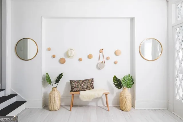 a white vase with flowers