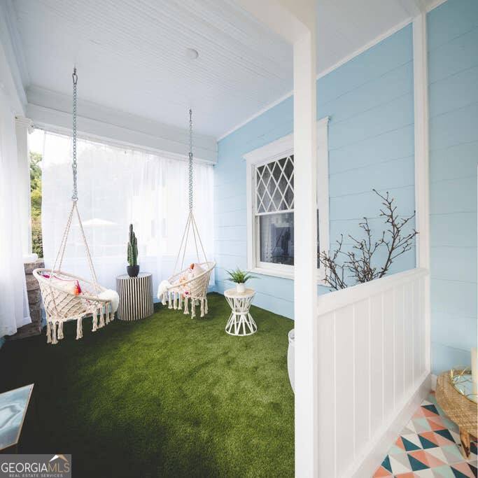 449 Greenwood Avenue Northeast, Unit 1 Atlanta, GA 30308 - Photo 6 of 27 a living room with furniture and a large window