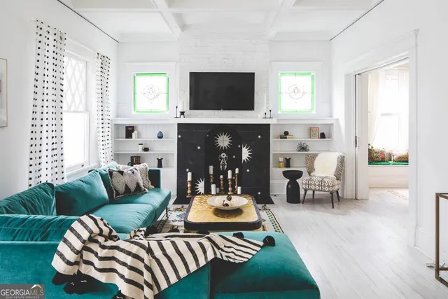 a living room with furniture and a flat screen tv