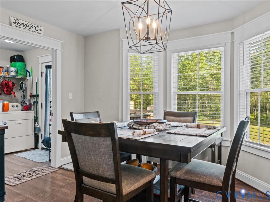 10819 Vaughan Road Petersburg, VA 23805 - Photo 20 of 45 Dining area featuring a bay window with multiple p