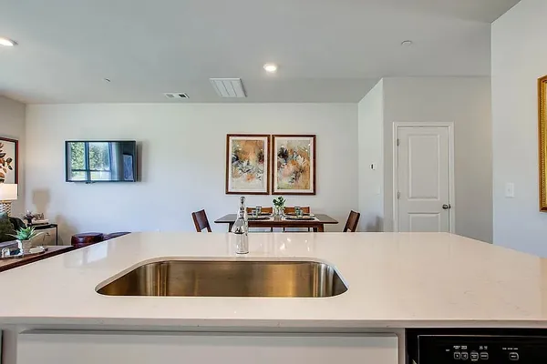 a kitchen with a sink and a refrigerator