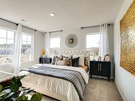 a bed room with a bed and a window