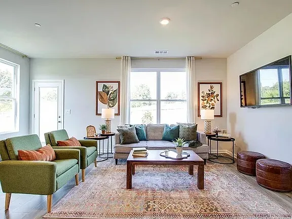 a living room with furniture and a window