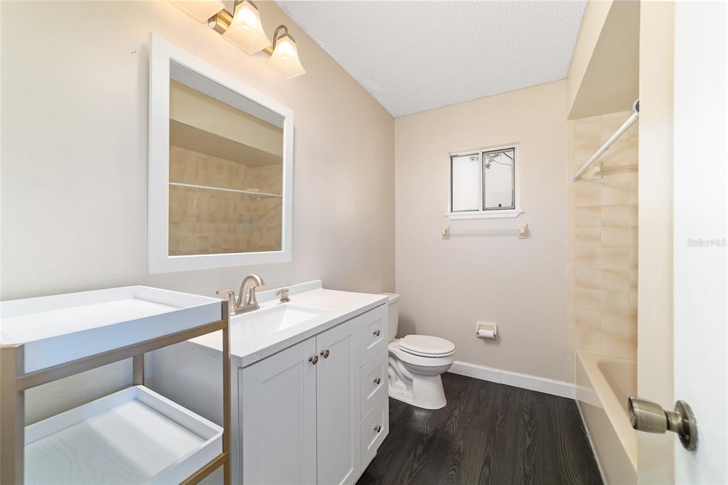 8329 Southwest 105th Place Ocala, FL 34481 - Photo 21 of 39 a bathroom with a sink toilet and a mirror