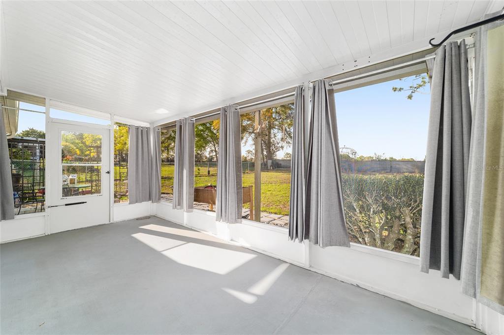 8329 Southwest 105th Place Ocala, FL 34481 - Photo 23 of 39 a view of an empty room with a large window