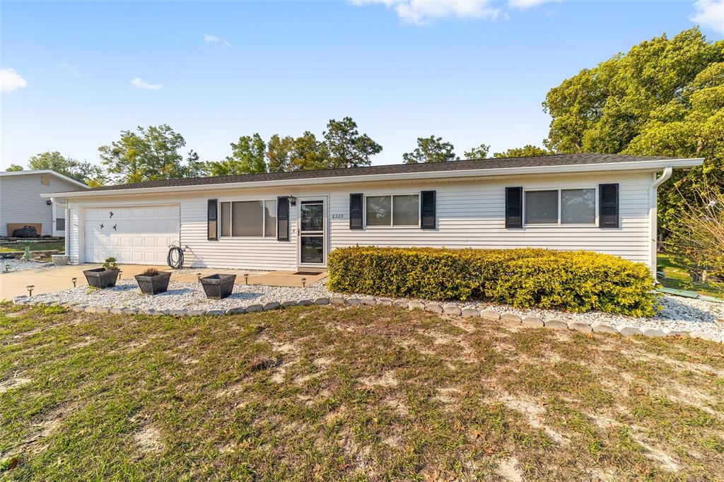 8329 Southwest 105th Place Ocala, FL 34481 - Photo 3 of 39 a view of a house with a patio