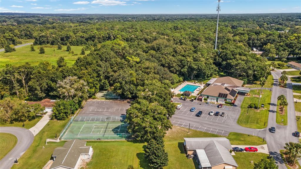 8329 Southwest 105th Place Ocala, FL 34481 - Photo 36 of 39 an aerial view of residential house with outdoor space and swimming pool