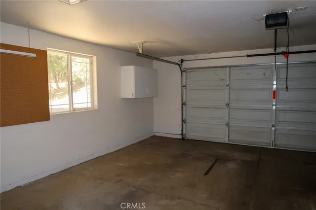 a view of a closet area fire place and window