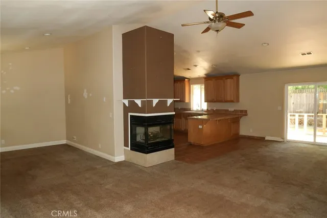 a kitchen with refrigerator and window