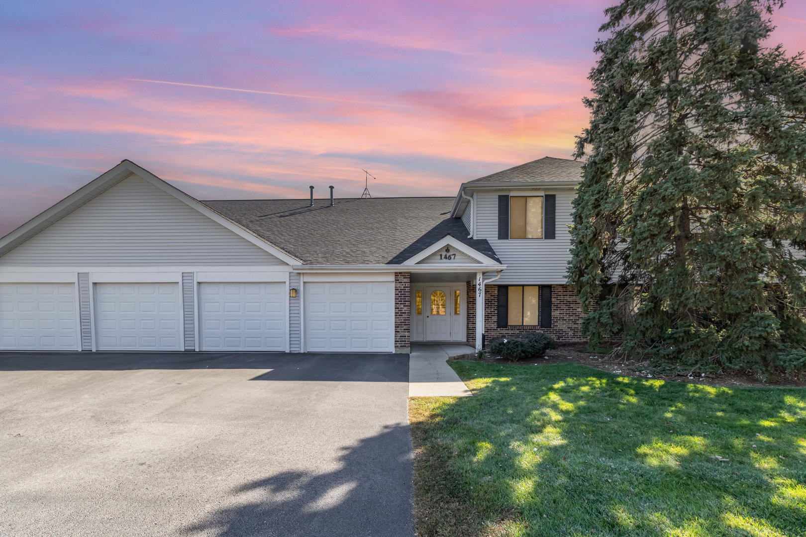 1467 Fairlane Drive, Unit 1B Schaumburg, IL 60193 - Photo 1 of 17 front view of a house with a yard