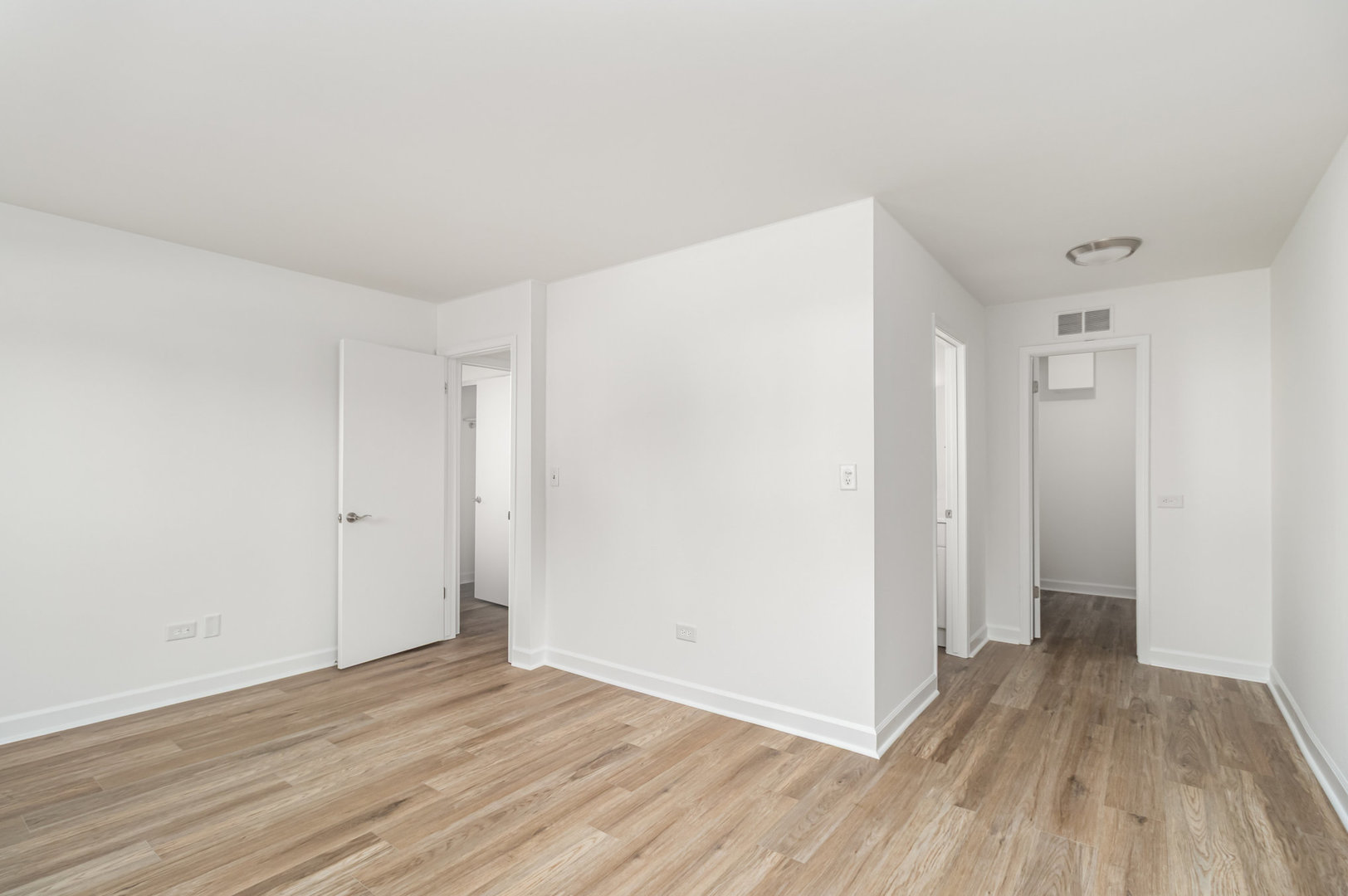 1467 Fairlane Drive, Unit 1B Schaumburg, IL 60193 - Photo 9 of 17 a view of a room with wooden floor