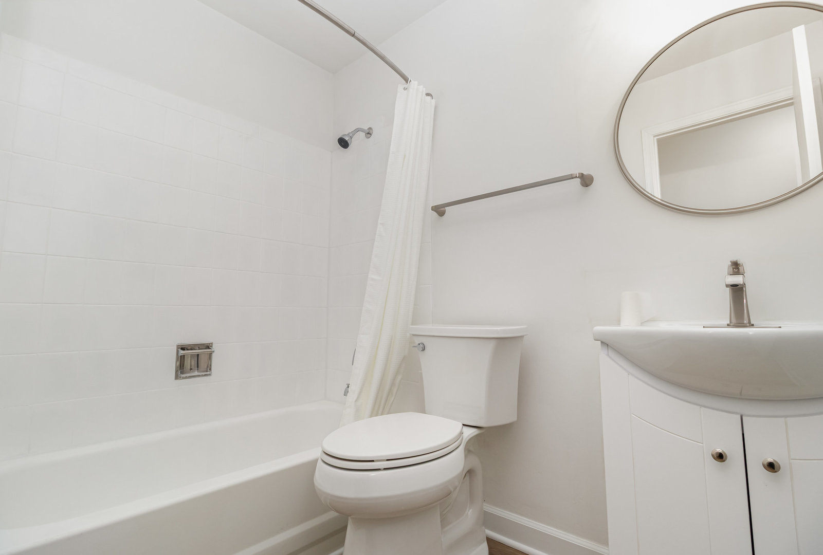 1467 Fairlane Drive, Unit 1B Schaumburg, IL 60193 - Photo 10 of 17 a bathroom with a sink toilet and a mirror