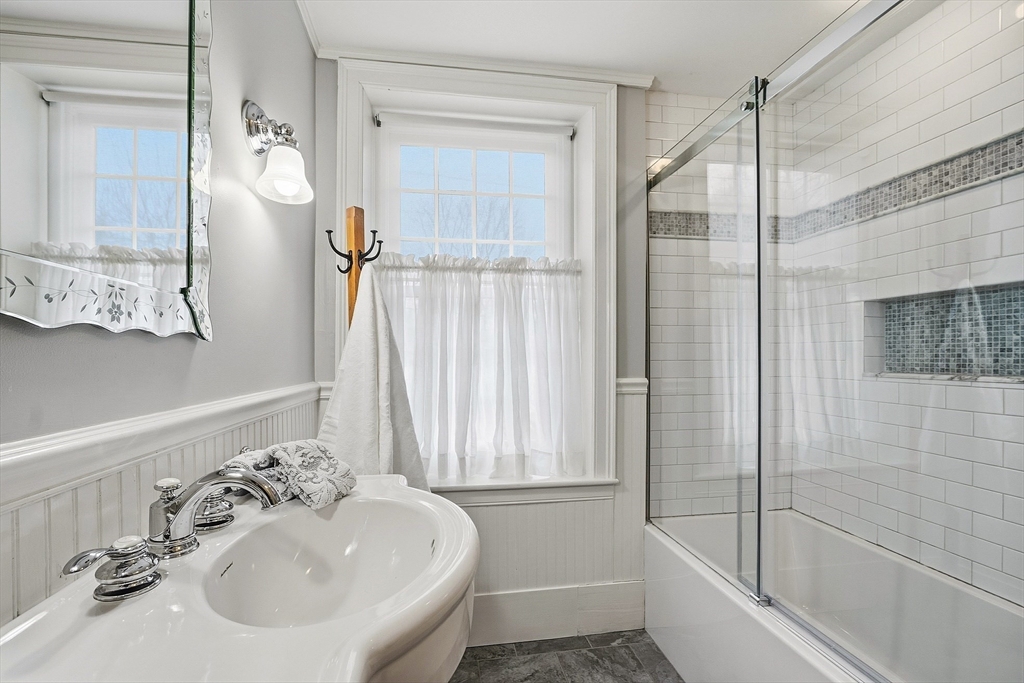 100 Main Street Ashburnham, MA 01430 - Photo 15 of 42 a bathroom with a sink a toilet and shower