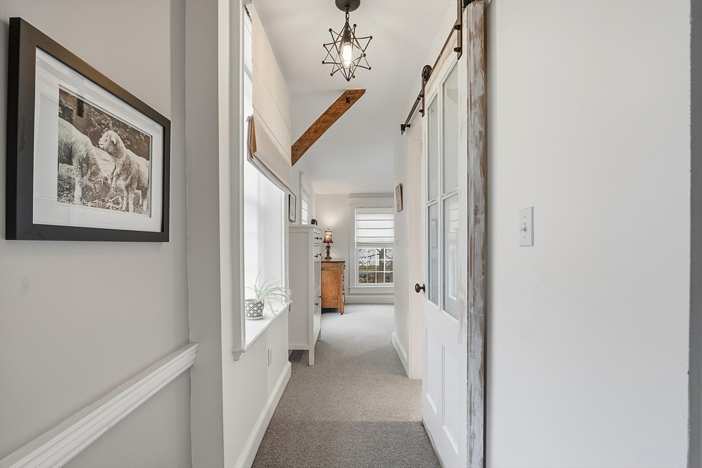 100 Main Street Ashburnham, MA 01430 - Photo 20 of 42 a view of a hallway with paintings on the wall