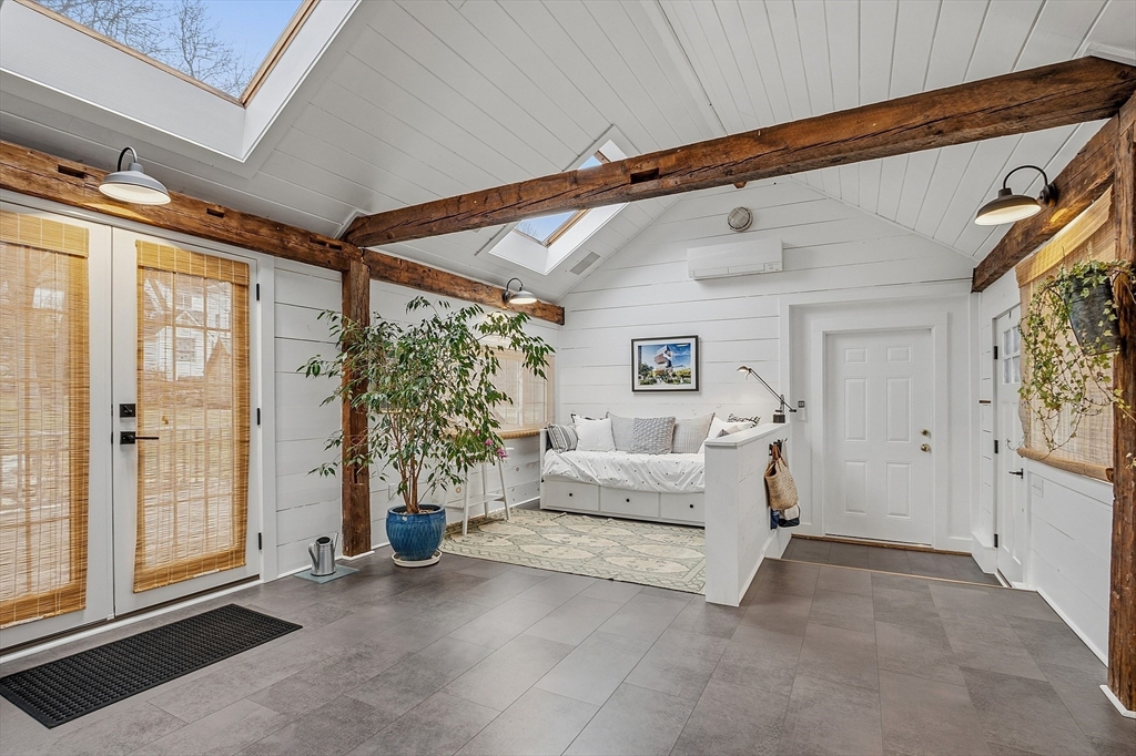 100 Main Street Ashburnham, MA 01430 - Photo 27 of 42 a bed room with a bed and a couch