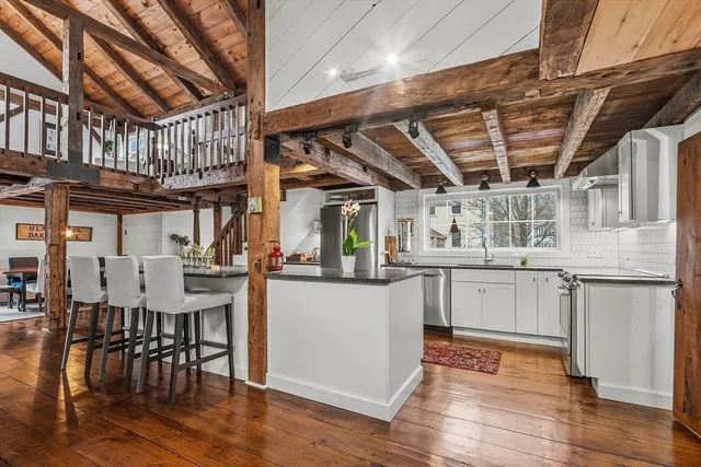 a kitchen with stove and cabinets