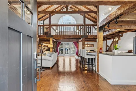 a view of a porch with wooden floor