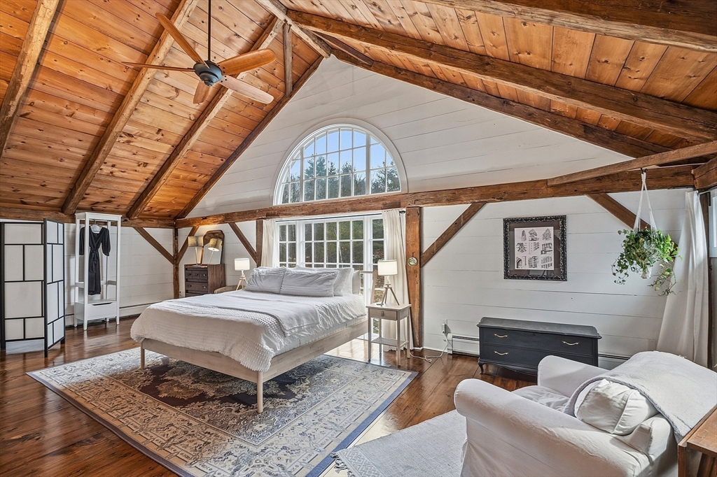100 Main Street Ashburnham, MA 01430 - Photo 38 of 42 a living room with a couch a rug and a fireplace