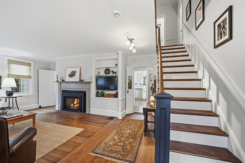 100 Main Street Ashburnham, MA 01430 - Photo 4 of 42 a living room with furniture and a fireplace