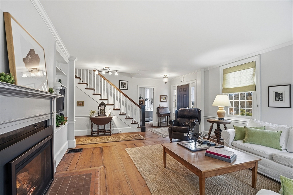 100 Main Street Ashburnham, MA 01430 - Photo 4 of 42 a living room with furniture and a fireplace