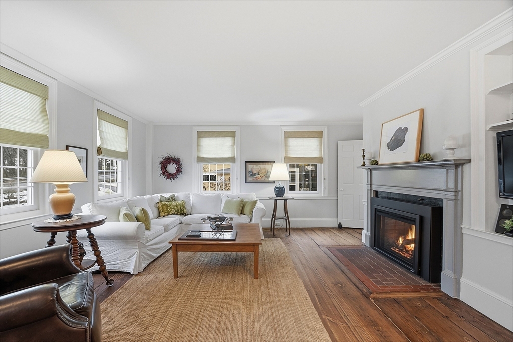 100 Main Street Ashburnham, MA 01430 - Photo 6 of 42 a living room with furniture and a fireplace