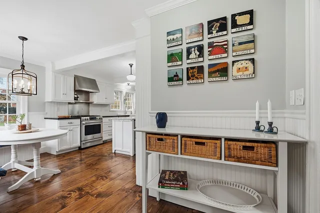 a living room with stainless steel appliances kitchen island granite countertop furniture and a kitchen view